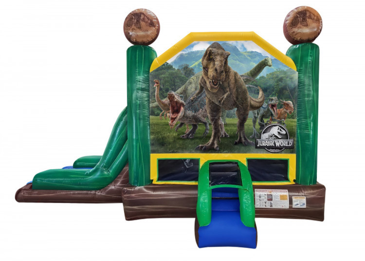 Jurassic Combo Module gonflable Jurassic Combo décoré de dinosaures avec zone de saut, toboggan et mur d’escalade.