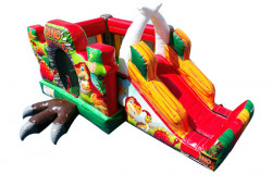 Vue avant du module gonflable Dino Party avec toboggan et déco dinosaures colorée.